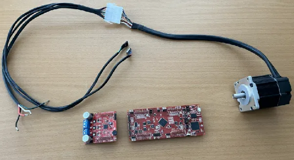 Reference setup: a small motor, the F280025C and a BOOSTXL-DRV8323RS power stage